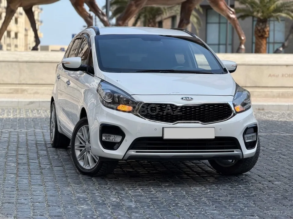 Kia Carens — фото 1/4