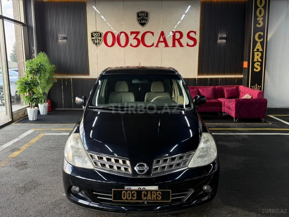 Nissan Tiida — foto 1/4