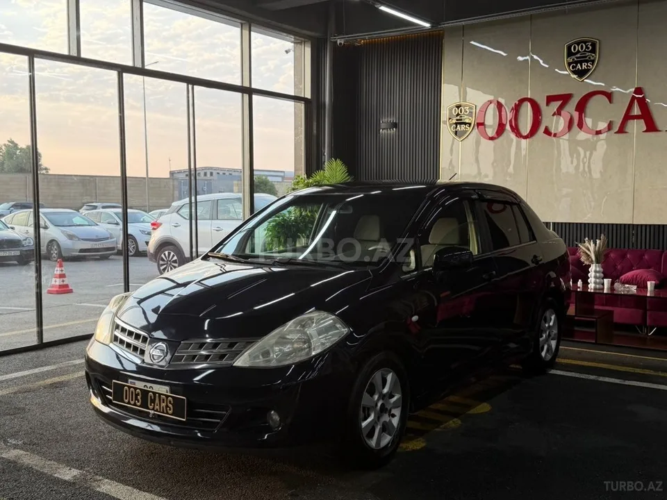 Nissan Tiida — foto 3/4