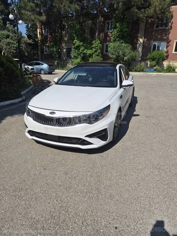 Kia Optima — foto 2/4