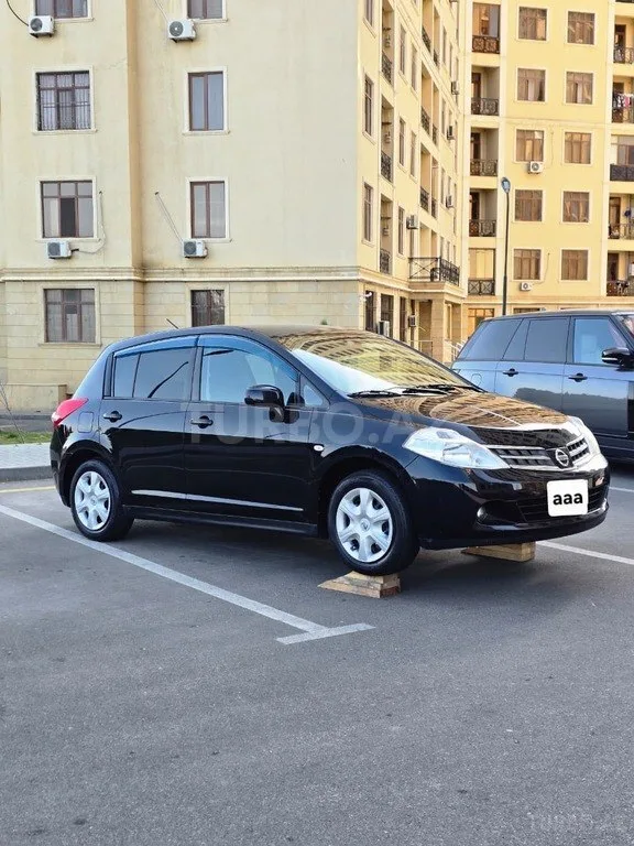 Nissan Tiida — foto 3/4
