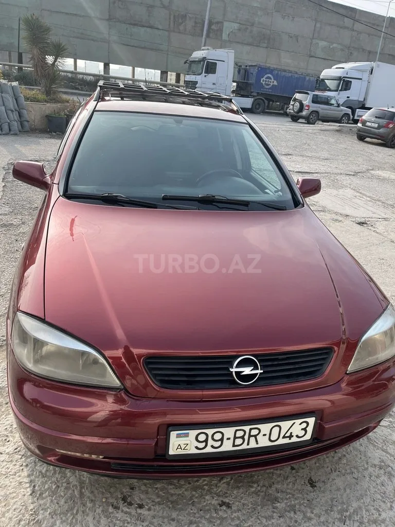 Opel Astra — фото 1/4