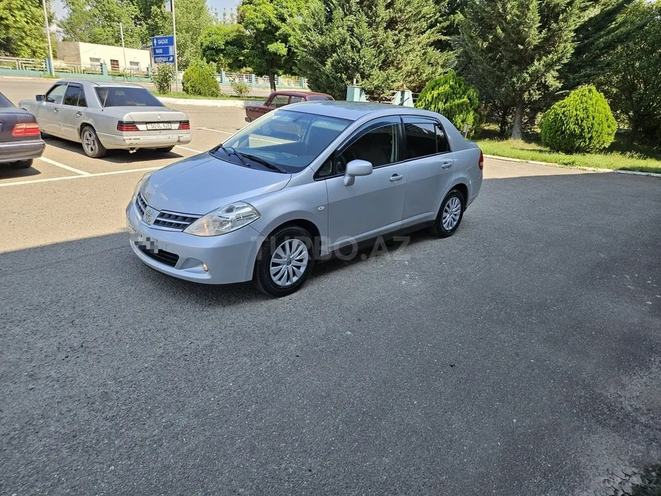 Nissan Tiida — foto 3/4