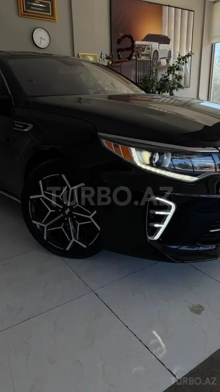 Kia Optima — foto 2/4